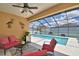 Enjoy lounging in this sunroom with screened view of a sparkling pool and patio at 421 Riders Loop, Auburndale, FL 33823
