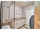 Laundry room with ample counter space, storage cabinets, and a convenient clothes hanging rack at 421 Riders Loop, Auburndale, FL 33823