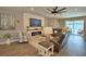 Inviting living room with fireplace, plush seating, and access to a screened pool area at 421 Riders Loop, Auburndale, FL 33823
