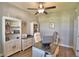 Well-lit home office featuring a modern desk, ample storage, and neutral decor at 421 Riders Loop, Auburndale, FL 33823