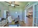 Comfortable home office with built-in shelving, wood floors and open views to the living room at 421 Riders Loop, Auburndale, FL 33823
