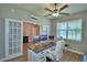 Bright office with French doors, wood-look floors, and a window with natural light at 421 Riders Loop, Auburndale, FL 33823