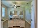 Bright office with a large desk, natural light, wood-look floors, and French doors at 421 Riders Loop, Auburndale, FL 33823