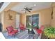 Relaxing screened patio area with comfortable seating and a view of the pool at 421 Riders Loop, Auburndale, FL 33823