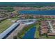 A wide aerial view of the community and maintenance facilities with lake view at 4356 Ashton Club Dr, Lake Wales, FL 33859