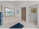 Serene bathroom featuring a tub, separate shower, and artistic window, perfect for unwinding in style at 4356 Ashton Club Dr, Lake Wales, FL 33859