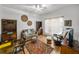 Cozy bedroom features ceiling fan, area rug, sofa, rocking chair and footstool at 4356 Ashton Club Dr, Lake Wales, FL 33859
