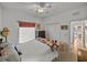Bedroom featuring wood floors, closet space and a window at 4356 Ashton Club Dr, Lake Wales, FL 33859