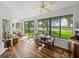 Bright dining area with scenic lake views from the expansive windows and access to outdoor space at 4356 Ashton Club Dr, Lake Wales, FL 33859