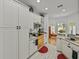 Kitchen with appliances and cabinetry with an adjacent sitting area at 4356 Ashton Club Dr, Lake Wales, FL 33859