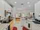 Kitchen featuring modern appliances, stylish countertops, and an adjacent sitting area at 4356 Ashton Club Dr, Lake Wales, FL 33859