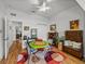 A vibrant rec room area features a colorful rug, game table, and additional seating at 4356 Ashton Club Dr, Lake Wales, FL 33859