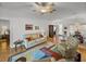 Inviting living room with ceiling fan, carpeting, and view of dining room at 4356 Ashton Club Dr, Lake Wales, FL 33859
