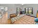 Main bedroom with wood floors, access to the outdoors, and a cozy seating area at 4356 Ashton Club Dr, Lake Wales, FL 33859