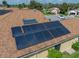 Aerial view of the home's roof with recently installed solar panels for energy efficiency at 4356 Ashton Club Dr, Lake Wales, FL 33859