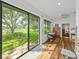 Inviting sunroom featuring floor to ceiling windows with serene views and access to the backyard at 4356 Ashton Club Dr, Lake Wales, FL 33859