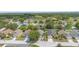 Aerial view of a residential neighborhood showcasing well-maintained homes and landscaping at 436 China Berry Cir, Davenport, FL 33837