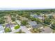Aerial shot showing the layout of a residential area with homes, streets, and surrounding greenery at 436 China Berry Cir, Davenport, FL 33837