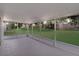 Screened-in lanai with string lights offering a cozy outdoor living space overlooking the backyard at 436 China Berry Cir, Davenport, FL 33837