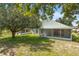 Large backyard with a covered patio at 436 China Berry Cir, Davenport, FL 33837
