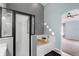 Bathroom featuring a glass shower, soaking tub, and neutral color palette at 436 China Berry Cir, Davenport, FL 33837
