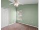 Simple bedroom featuring neutral walls, carpet, a window and ample space at 436 China Berry Cir, Davenport, FL 33837