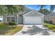 Inviting single-Gathering home with a tidy front yard and attached garage at 436 China Berry Cir, Davenport, FL 33837