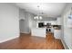 Bright open kitchen with stainless appliances, white cabinets, breakfast bar and adjacent to the dining area at 436 China Berry Cir, Davenport, FL 33837