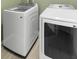 Modern laundry room featuring a new washer and dryer at 436 China Berry Cir, Davenport, FL 33837