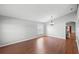 Bright living room featuring hardwood floors, neutral walls, and natural light at 436 China Berry Cir, Davenport, FL 33837