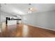 Open floor plan showcasing the spacious living area and modern kitchen with stainless appliances at 436 China Berry Cir, Davenport, FL 33837