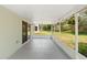 Covered outdoor patio with screen overlooking the backyard at 436 China Berry Cir, Davenport, FL 33837