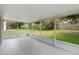 A screened outdoor patio with views of a large backyard at 436 China Berry Cir, Davenport, FL 33837