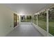 A covered patio with screening and bright lighting at 436 China Berry Cir, Davenport, FL 33837