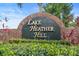Community entrance sign reading Lake Heather Hill at 436 China Berry Cir, Davenport, FL 33837