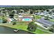 Aerial view of the community, showing the pool, lake, and recreation areas at 4941 Foxdale Dr, Lakeland, FL 33810