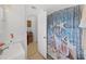 Bathroom showcasing the walk-in shower with a decorative shower curtain at 4941 Foxdale Dr, Lakeland, FL 33810