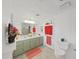 Bathroom with dual sinks, decorative towels, and updated fixtures at 4941 Foxdale Dr, Lakeland, FL 33810