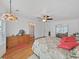 This bright bedroom has hardwood floors, and a ceiling fan at 4941 Foxdale Dr, Lakeland, FL 33810