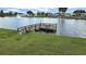 Charming wooden pier to the community lake with seating to enjoy views of the community water feature at 4941 Foxdale Dr, Lakeland, FL 33810