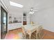 Dining room with natural light, built-in shelving, and skylight that provides a warm and inviting space for meals at 4941 Foxdale Dr, Lakeland, FL 33810