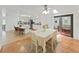 Dining area featuring hardwood floors with an open layout, perfect for entertaining guests and Gathering at 4941 Foxdale Dr, Lakeland, FL 33810