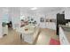 Bright kitchen with a cooktop island, open to the dining area, and modern appliances at 4941 Foxdale Dr, Lakeland, FL 33810