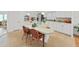 Bright kitchen features a large island with seating, white cabinetry, and modern appliances at 4941 Foxdale Dr, Lakeland, FL 33810