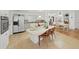 Bright kitchen features a large island with seating, white cabinetry, and is open to the dining area at 4941 Foxdale Dr, Lakeland, FL 33810