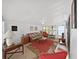 Cozy sunroom features neutral paint, ceiling fan and furnishings, and access to the back yard at 4941 Foxdale Dr, Lakeland, FL 33810