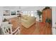Bright living room featuring hardwood floors, built-in shelves, and lots of natural light from large windows at 4941 Foxdale Dr, Lakeland, FL 33810
