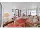 Cozy sunroom features neutral paint, ceiling fan and furnishings, and access to the back yard at 4941 Foxdale Dr, Lakeland, FL 33810