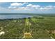 Expansive property features lush forest and pond; outlined to show boundaries with lake in background at 4949 Lake Kotsa Dr, Lake Wales, FL 33898