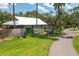 Spacious backyard with a swing, grill, and fire pit, perfect for outdoor entertaining at 4949 Lake Kotsa Dr, Lake Wales, FL 33898
